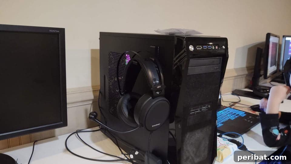 The Ultimate Command Strip Guide 75 Ingenious Uses and Application Tips 13 Headphones hanging from the side of a computer monitor.