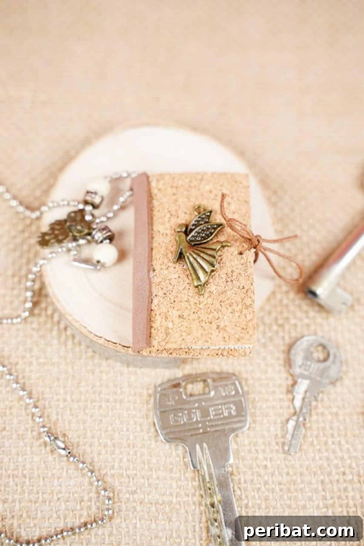 Mini book keychain on burlap surface