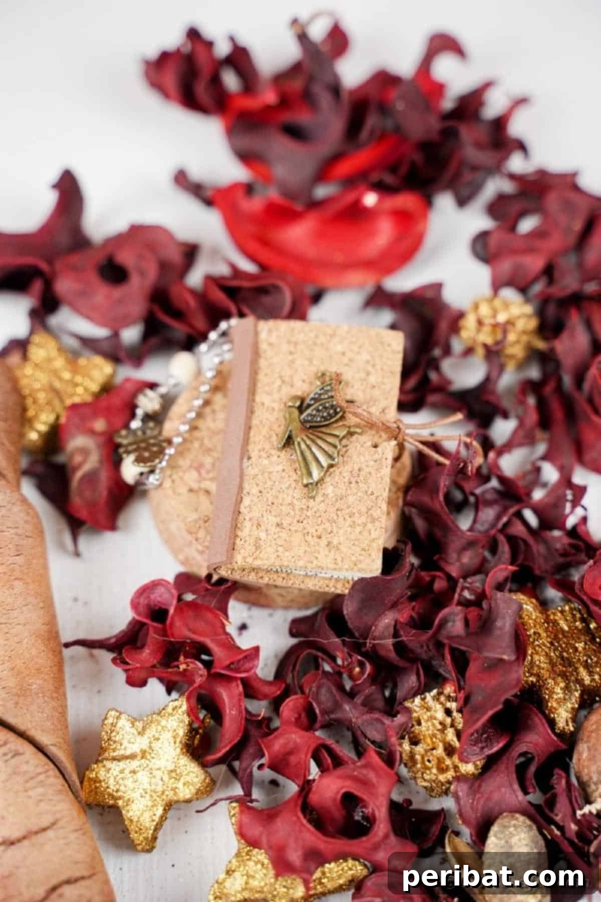 Miniature book keychain on decorative potpourri
