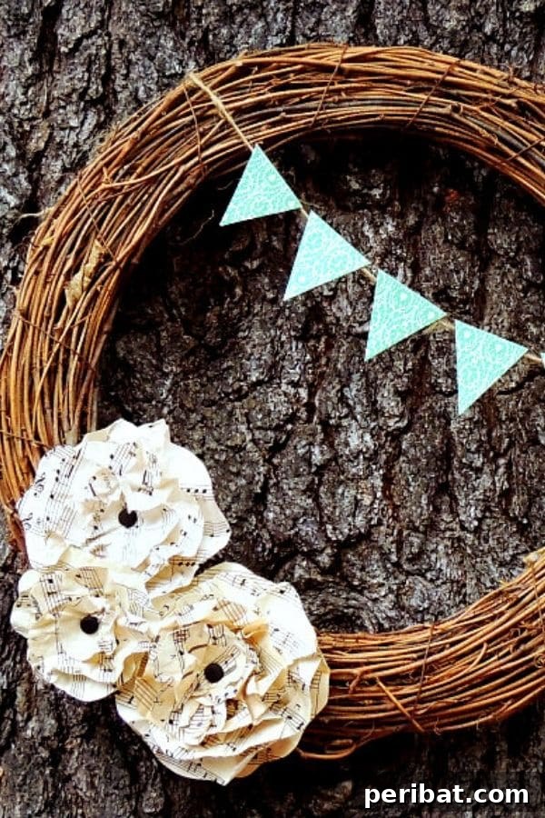 Simple grapevine wreath adorned with delicate sheet music flowers