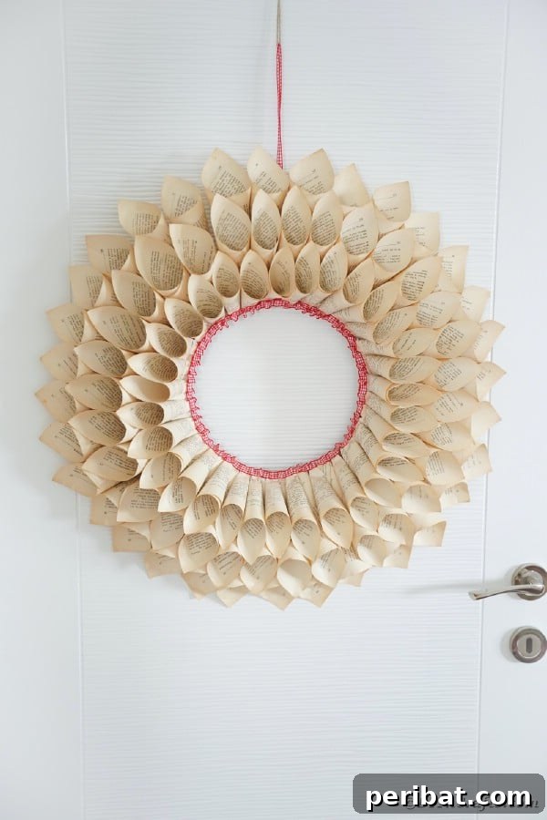 Rustic paper cone wreath with red-edged book pages