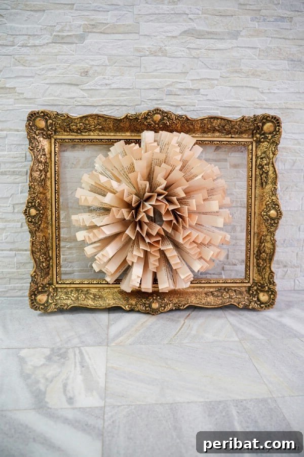 Exquisite framed paper flower made from old book pages, suitable as a unique wreath
