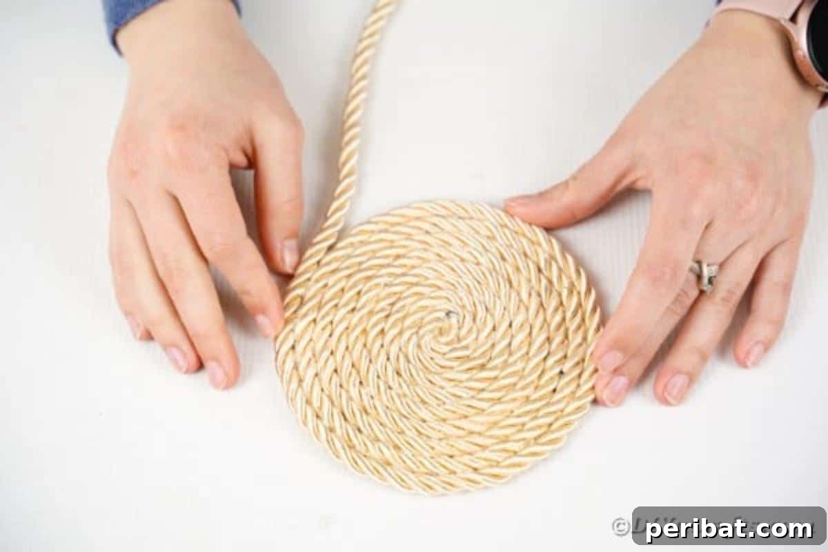 Effortless Chic DIY Rope Bag Tutorial 11 A completed rope circle, approximately 10 inches wide, laying flat