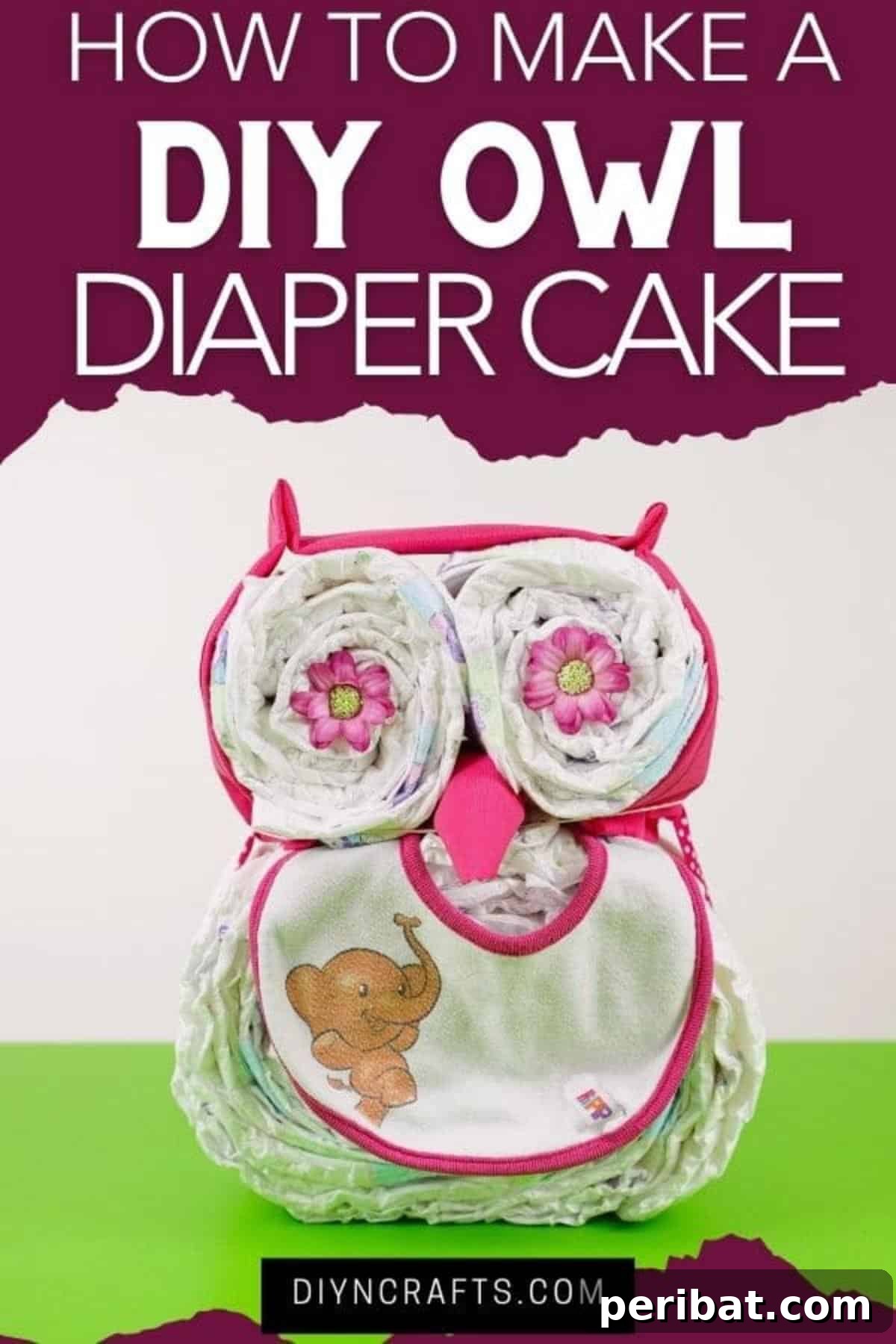 Owl diaper cake on green table