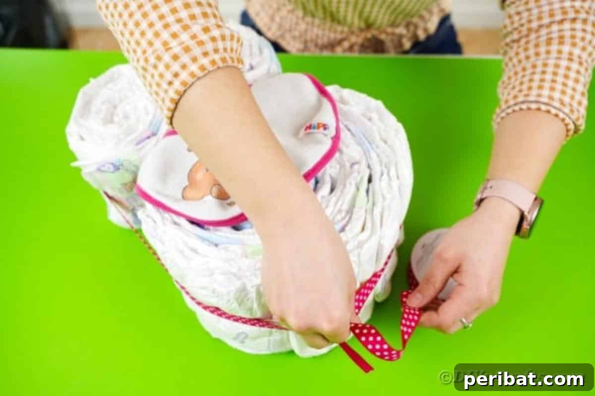 Wrapping ribbon around owl
