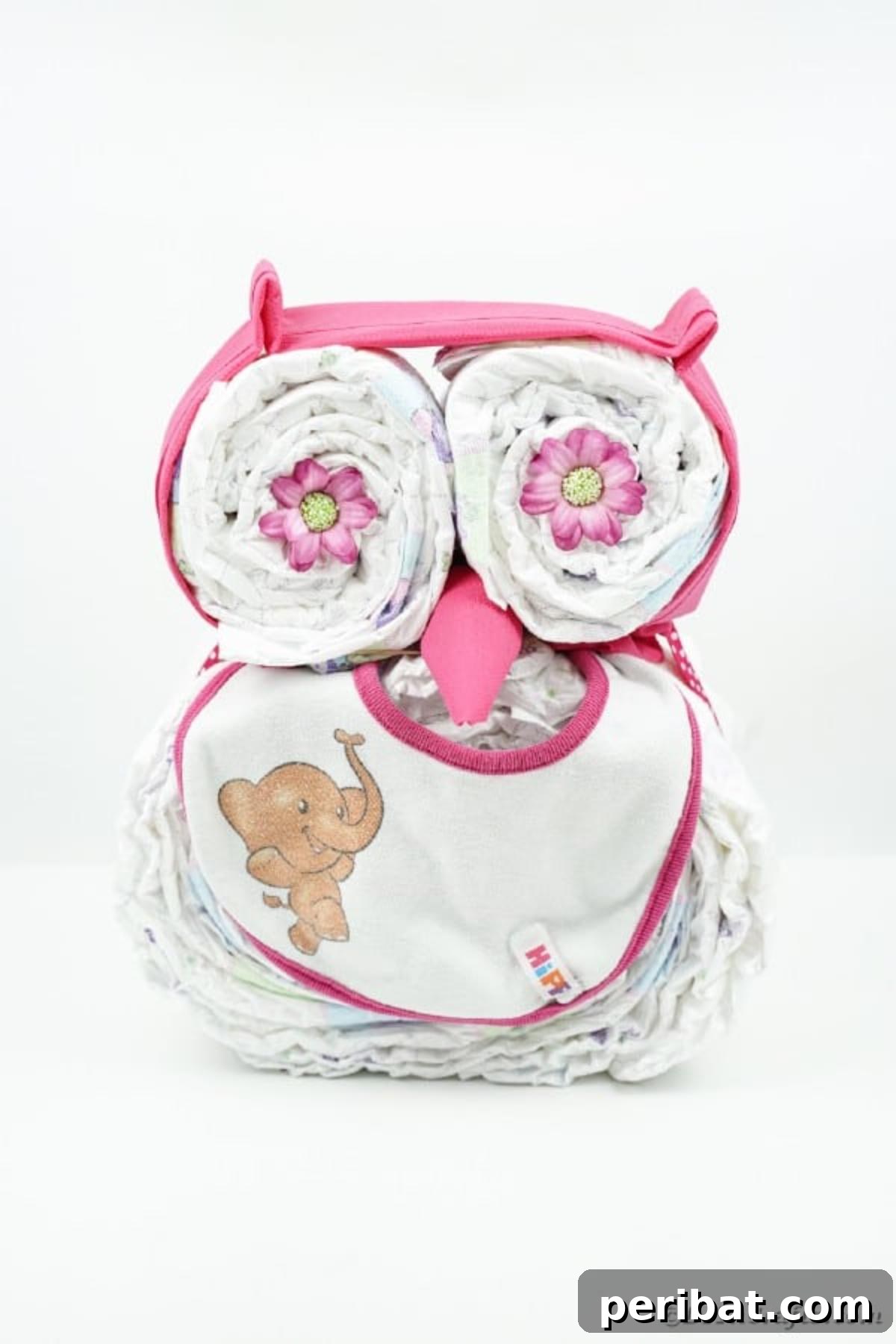Diaper cake owl on white surface