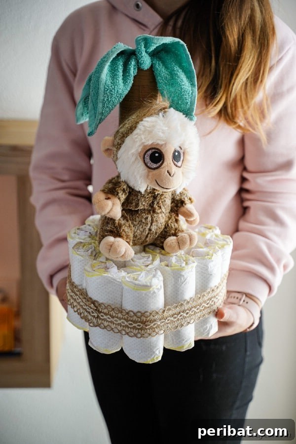 Sweet Safari Palm Diaper Cake 19 Woman holding diaper cake