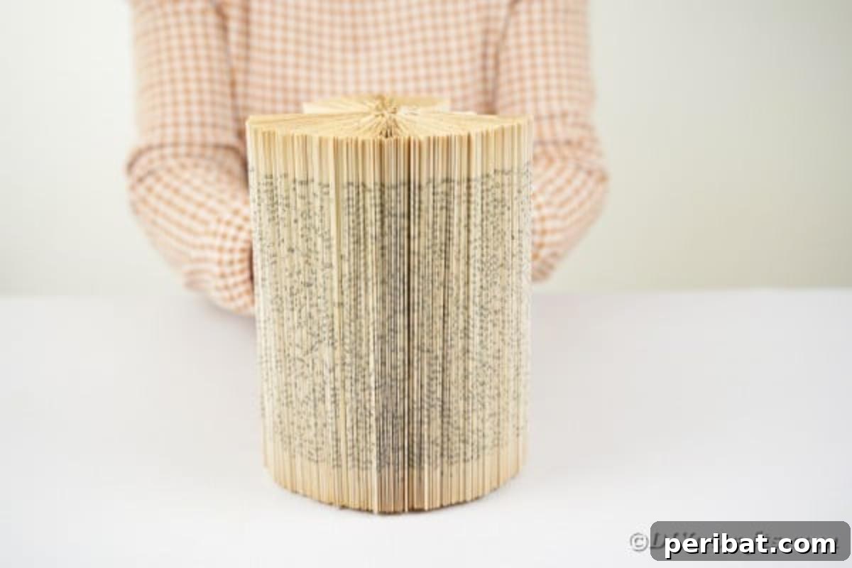 Rolling old book into sphere