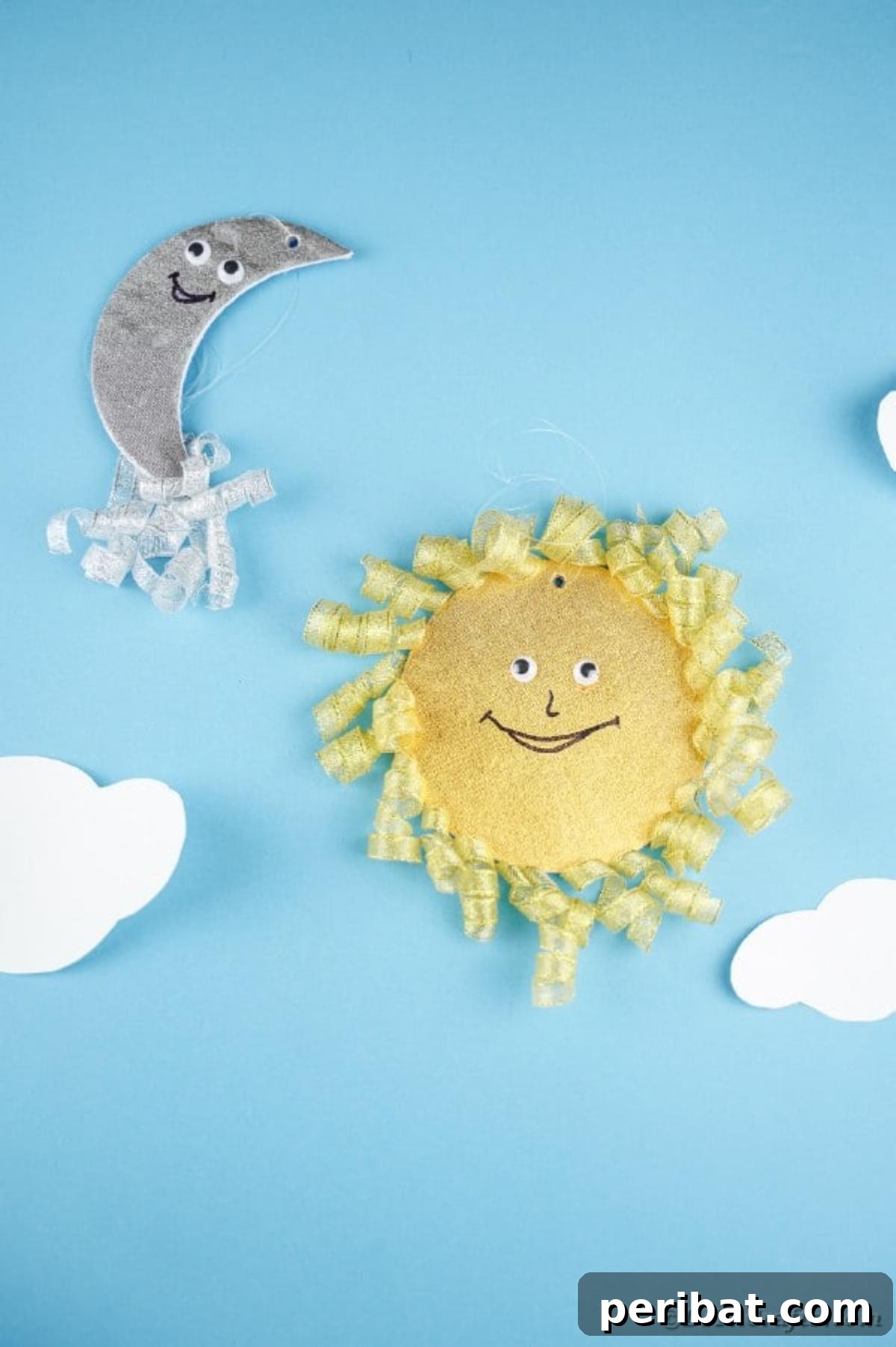Sparkling CD Moon & Sun Nursery Mobile 29 Sun and moon decoration on blue wall with clouds