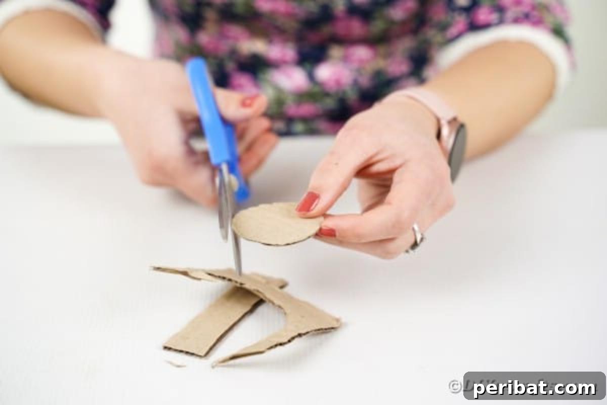 Cutting a cardboard circle with scissors