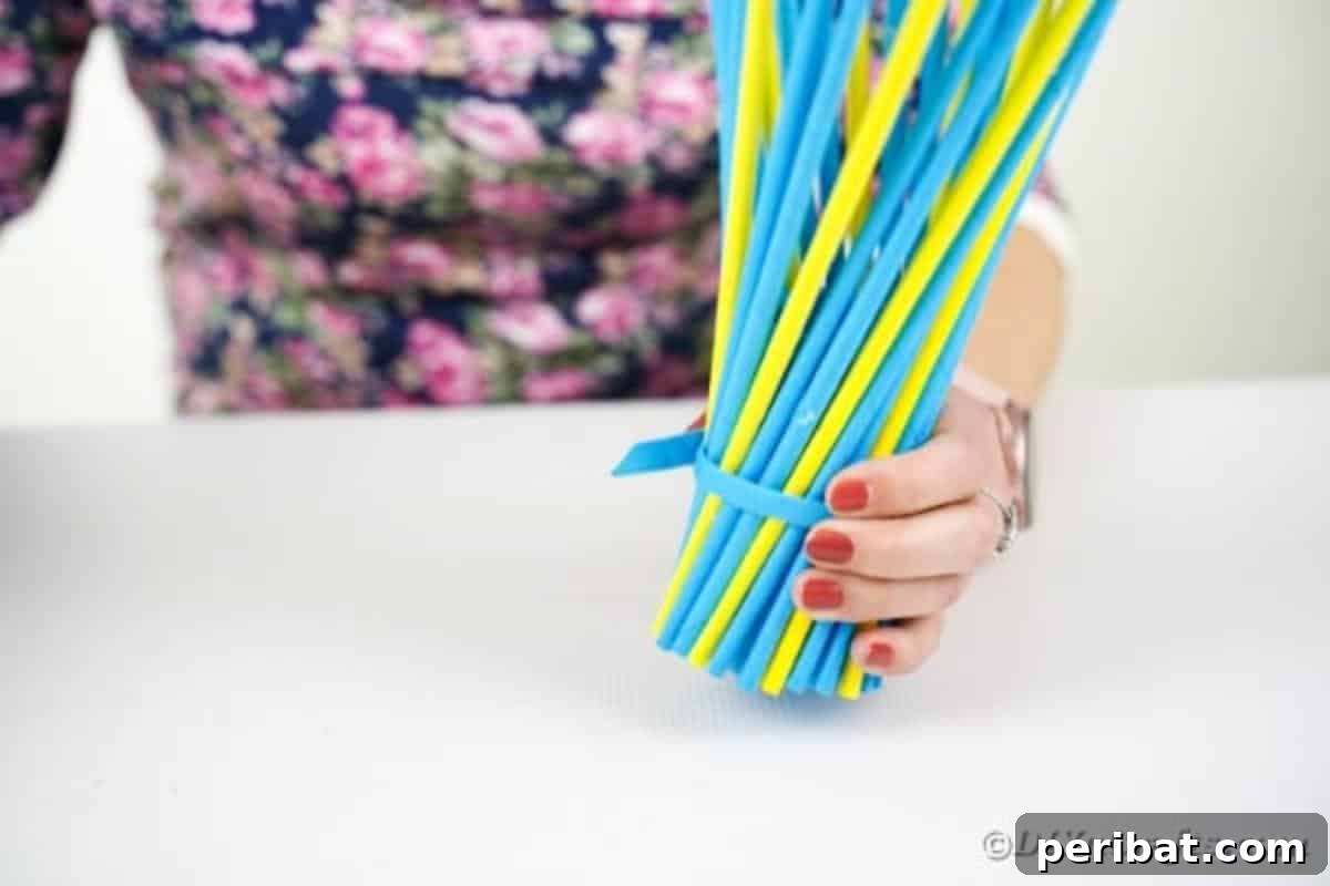 Gluing a paper band onto the middle of the vase