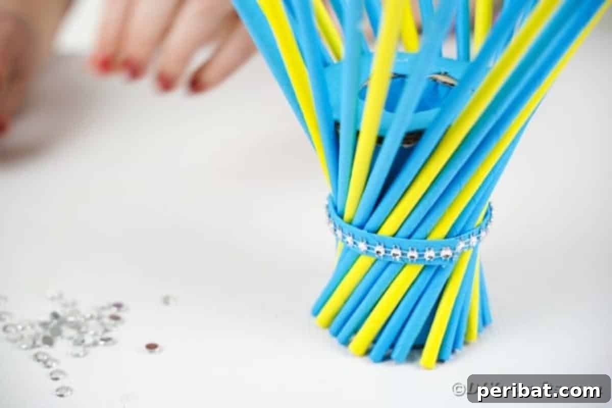 Close-up of beads glued around the vase's center