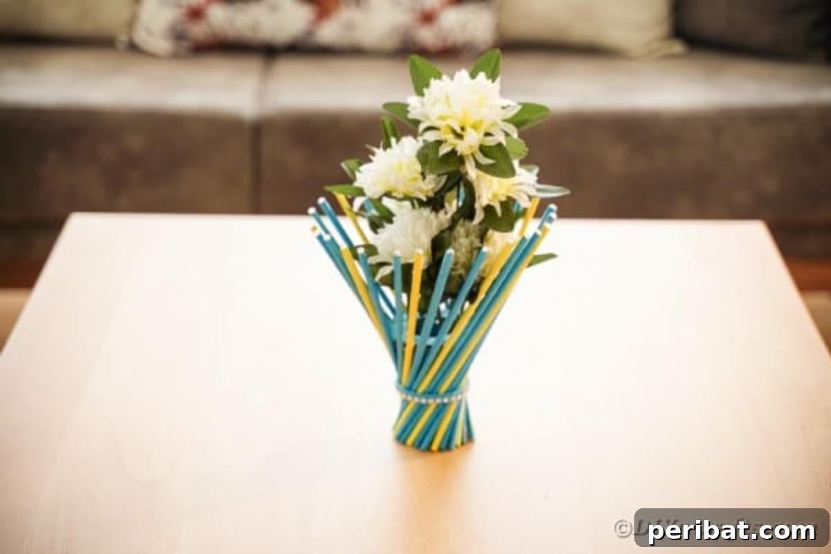 Colorful stick vase on wood table, demonstrating its size