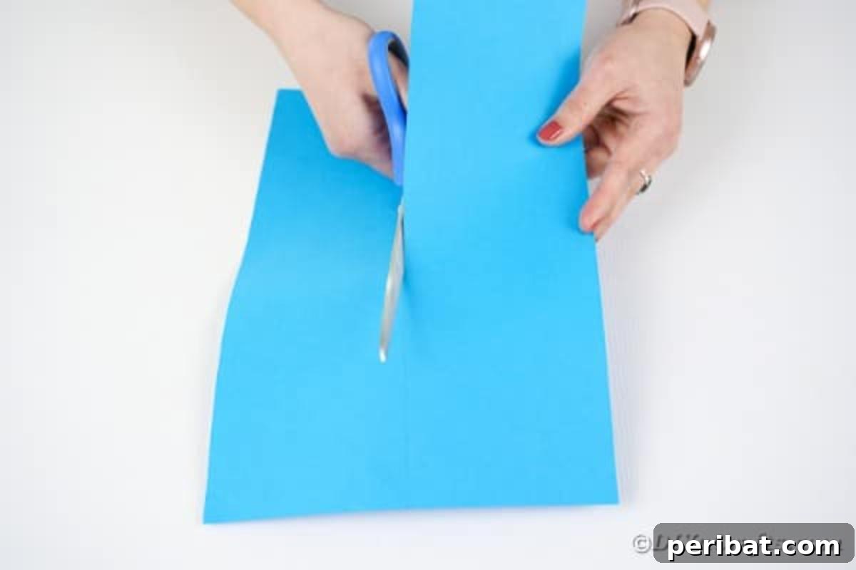 Cutting a strip of paper with scissors