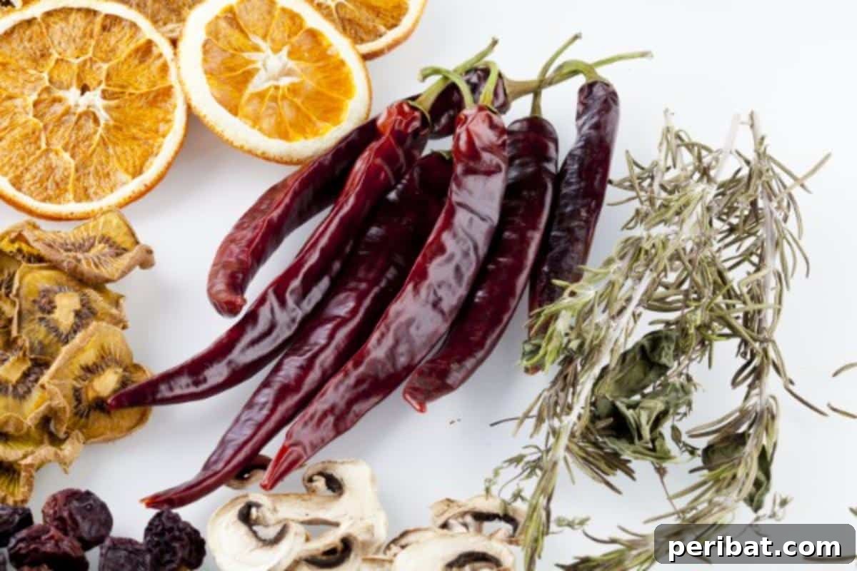 Extend Your Garden Harvest: 3 Simple Preservation Methods and 20 Flavorful Recipes 10 Dried herbs and orange slice