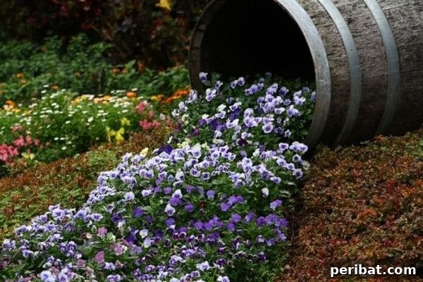 Cascading Flower Pot Art for Stunning Garden Decor 10 A rustic whiskey barrel overflowing with green and white wildflowers, creating a natural, flowing river of blossoms.