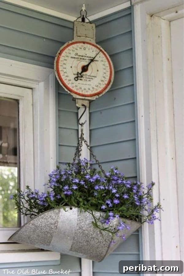 32 DIY Vintage Garden Crafts to Add Rustic Charm 27 A vintage kitchen scale repurposed as a charming planter, holding delicate flowers on a garden shelf.