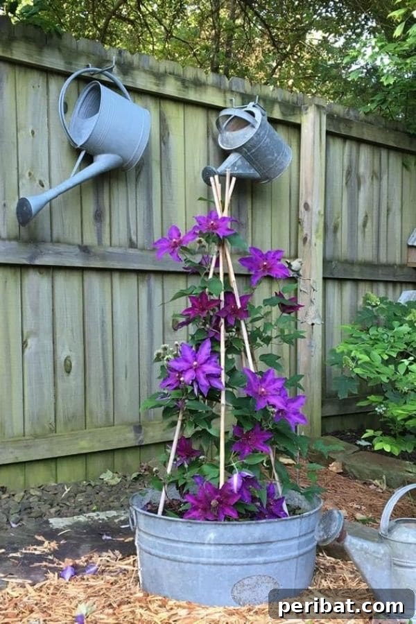 32 DIY Vintage Garden Crafts to Add Rustic Charm 9 A vintage galvanized washtub repurposed as a planter with a climbing trellis, accompanied by antique watering cans.