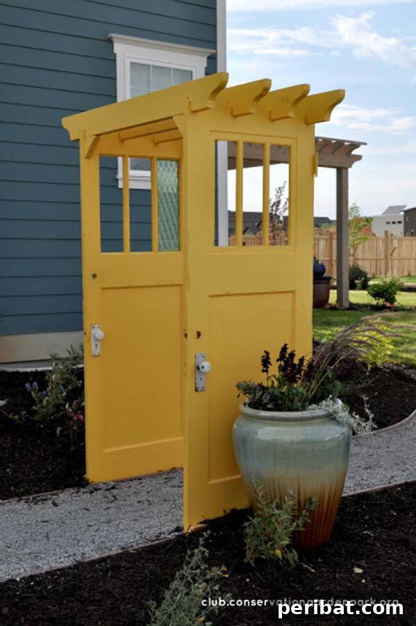 Yellow door pergola creating an archway over a path