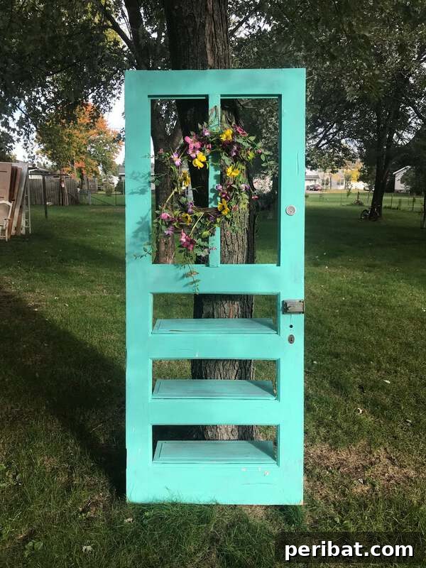 Teal old door shelf created from a repurposed antique door