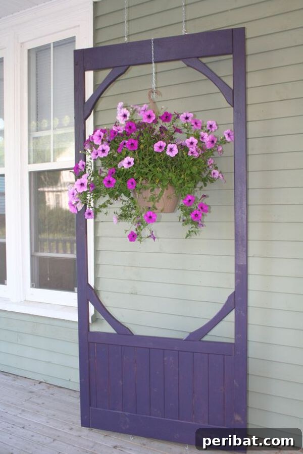 Purple hanging plant stand made from an old door