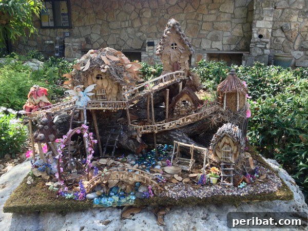 A rustic fairy garden featuring miniature houses, natural elements, and small plants creating a whimsical scene