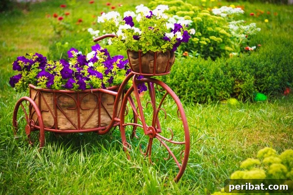 A vintage, rusty bicycle repurposed as a unique garden planter, with baskets filled with colorful flowers