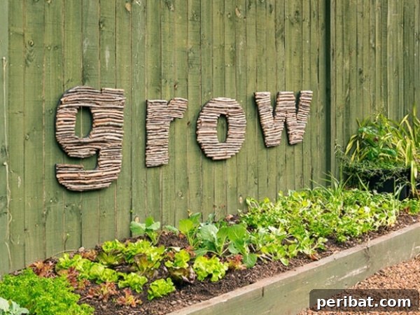 The word 'GROW' spelled out with twigs on a garden wall
