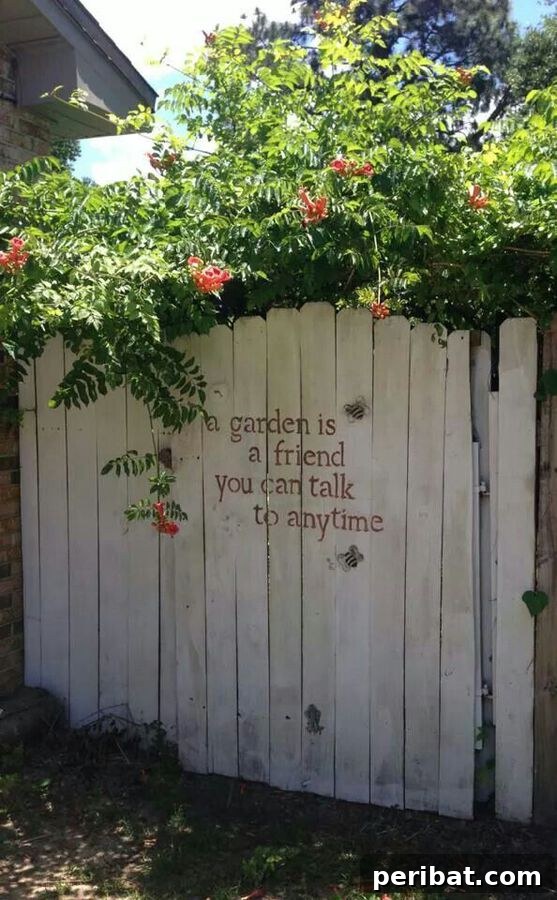 A stenciled quote on a garden fence, adding a personal touch