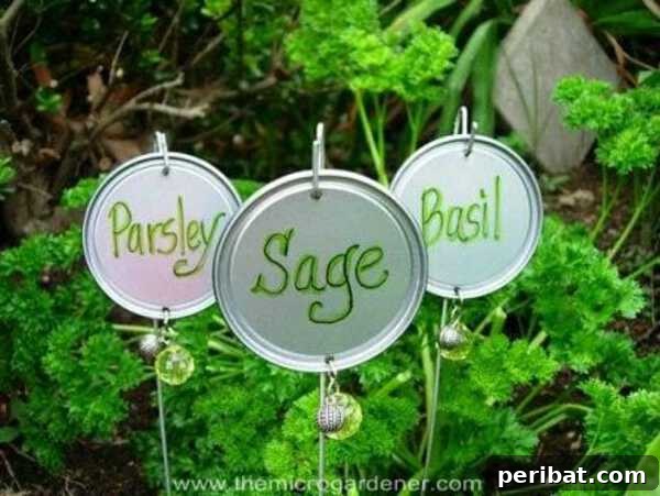 Plant markers made from repurposed mason jar lids with plant names and bead embellishments