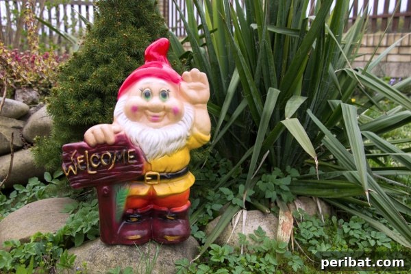 Garden gnome holding a 'Welcome' sign