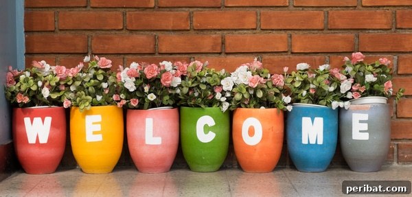 Stacked painted flower pots forming a welcome sign