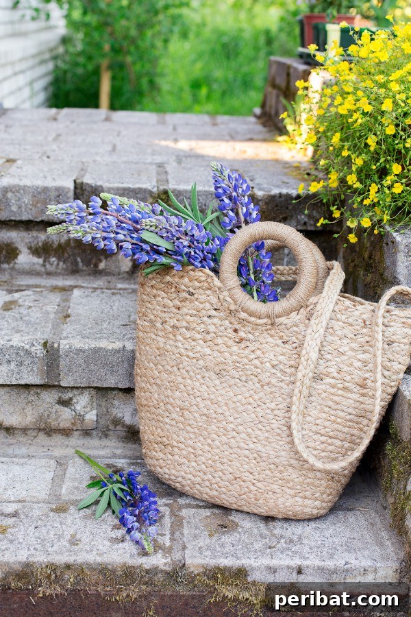 Wicker basket filled with cut flowers on porch steps
