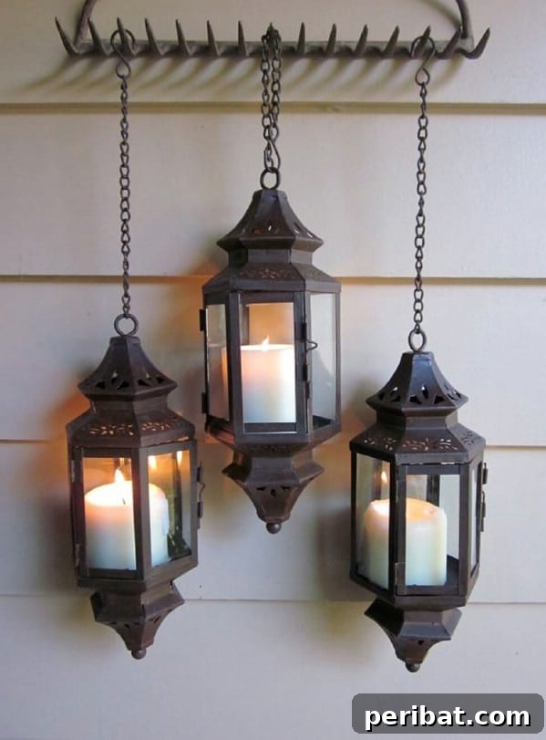 Black metal hanging lanterns on a porch wall