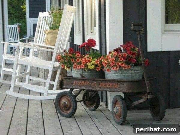 Old red wagon filled with flowers on a porch