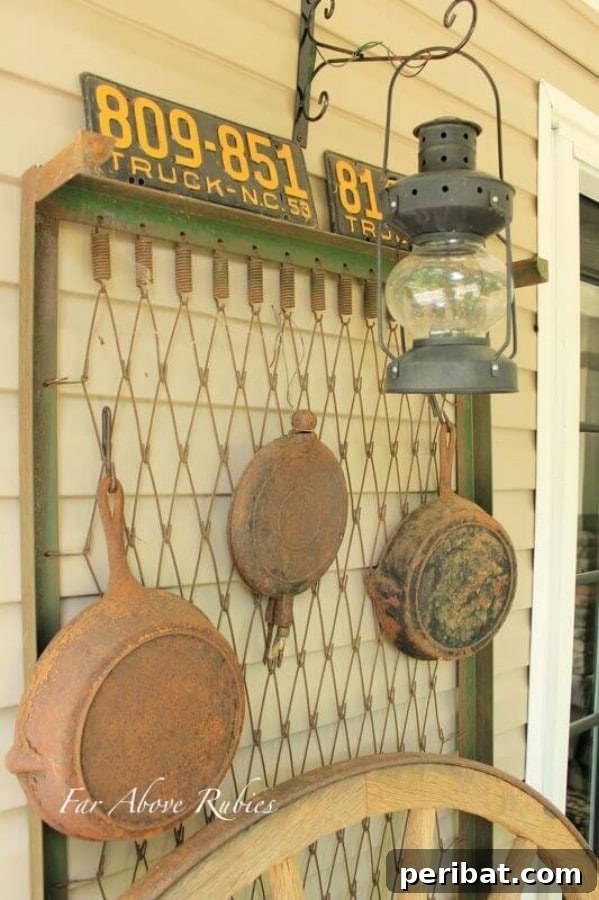 Old box spring leaned against a wall, displaying cast iron cookware