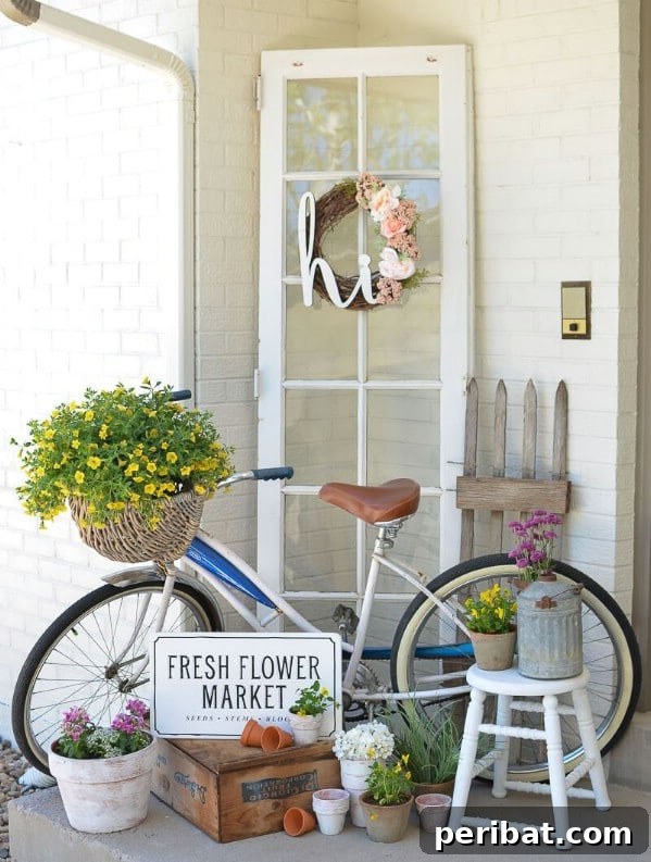 Bright white vintage bicycle with a wicker basket of flowers