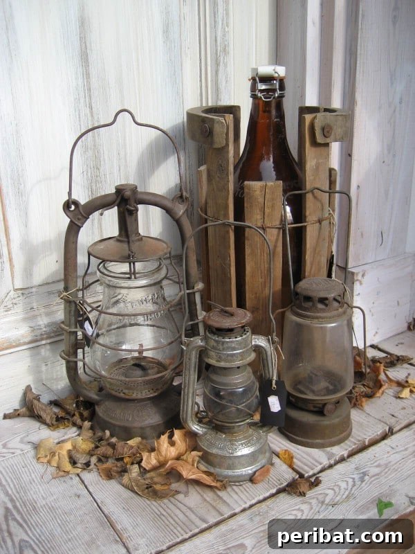 Stack of old rusty lanterns on a porch