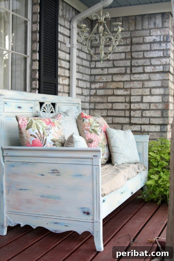 Weathered wood bench with vintage cushions on a porch