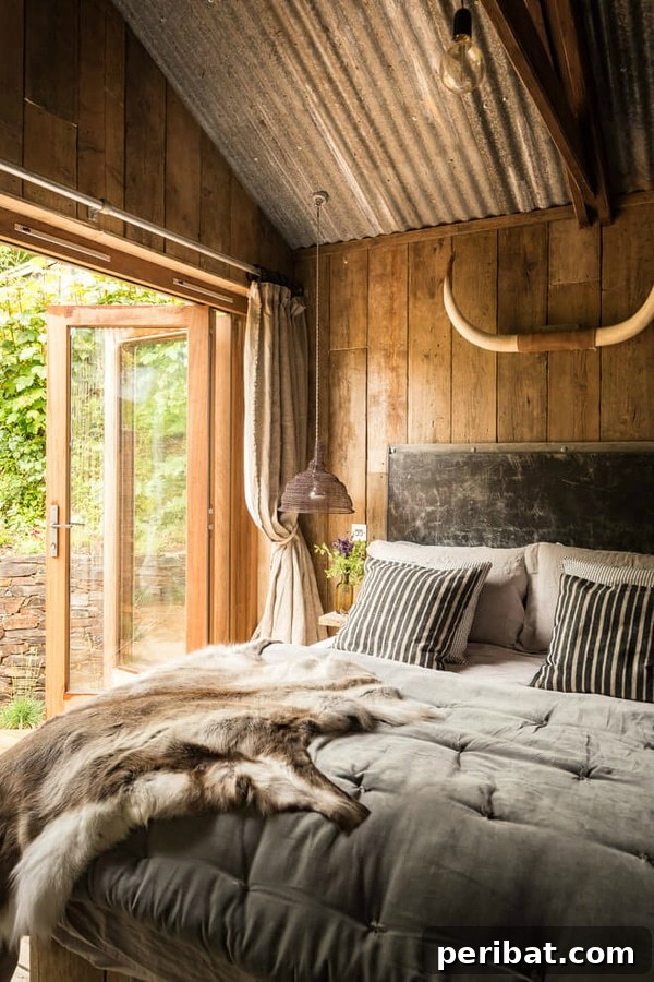Creating Your Rustic Bedroom Oasis 7 Bedroom with wood wall and antlers above the bed