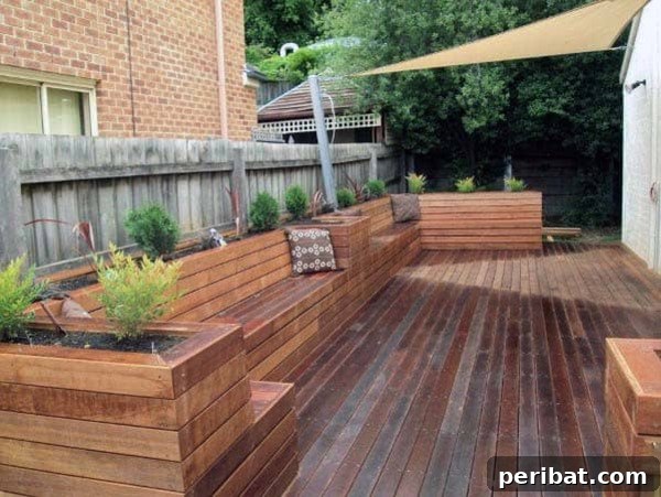 Smart DIY Integrated Planters for Maximizing Tiny Outdoor Areas 16 A wooden deck with built-in benches backed by deep planters.