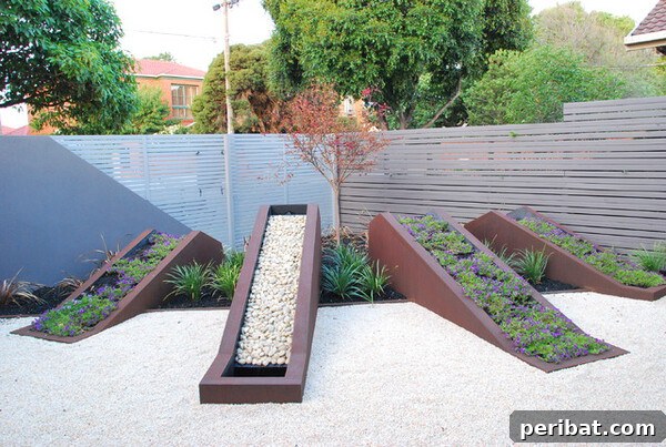 Smart DIY Integrated Planters for Maximizing Tiny Outdoor Areas 20 A unique sloping planter box designed to fit into a corner, filled with pebbles and small plants.