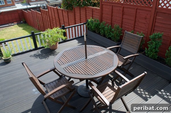 Smart DIY Integrated Planters for Maximizing Tiny Outdoor Areas 25 A composite porch lined with large, matching planter boxes against a fence wall.