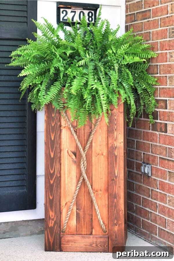 Smart DIY Integrated Planters for Maximizing Tiny Outdoor Areas 8 A large, built-in wooden planter flanking a front door, enhancing the entrance with greenery.