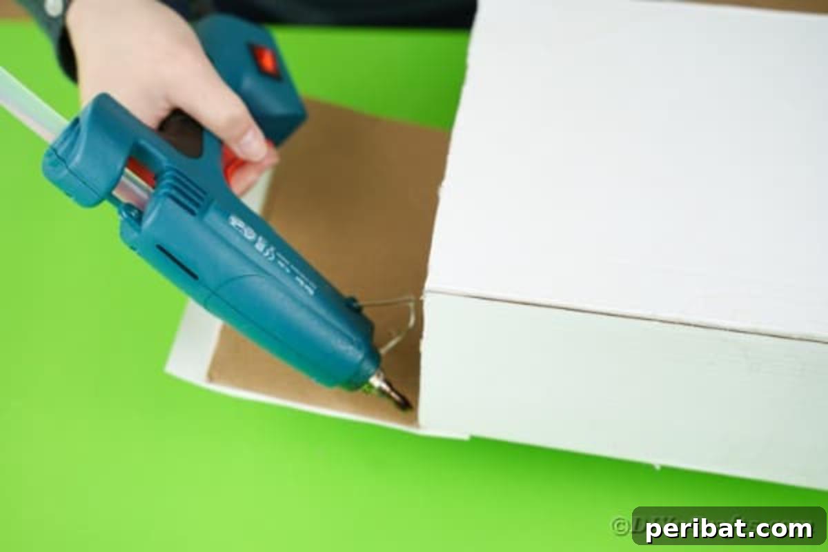 Gluing end onto paper box