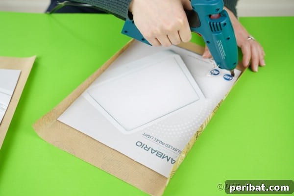 Gluing cardboard to wrapping paper