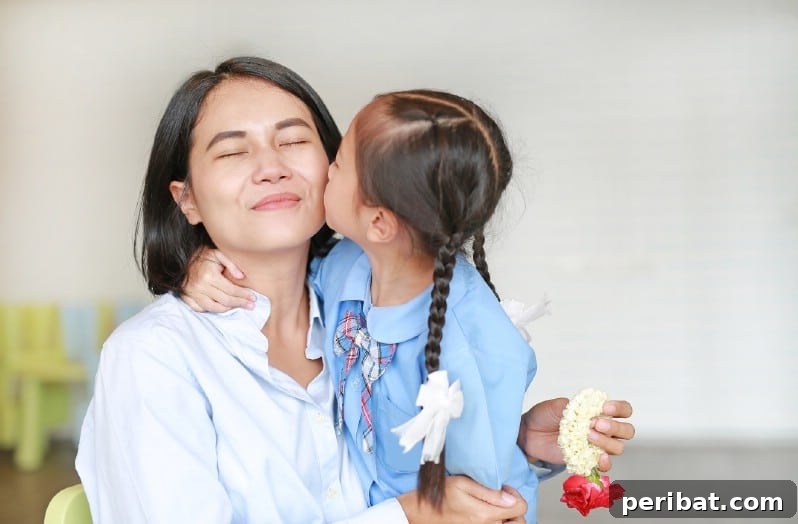 Girl kissing her mother happily.