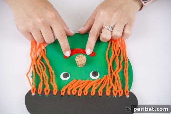 Spooktacular Paper Plate Witch Craft 27 Gluing smile onto witch face