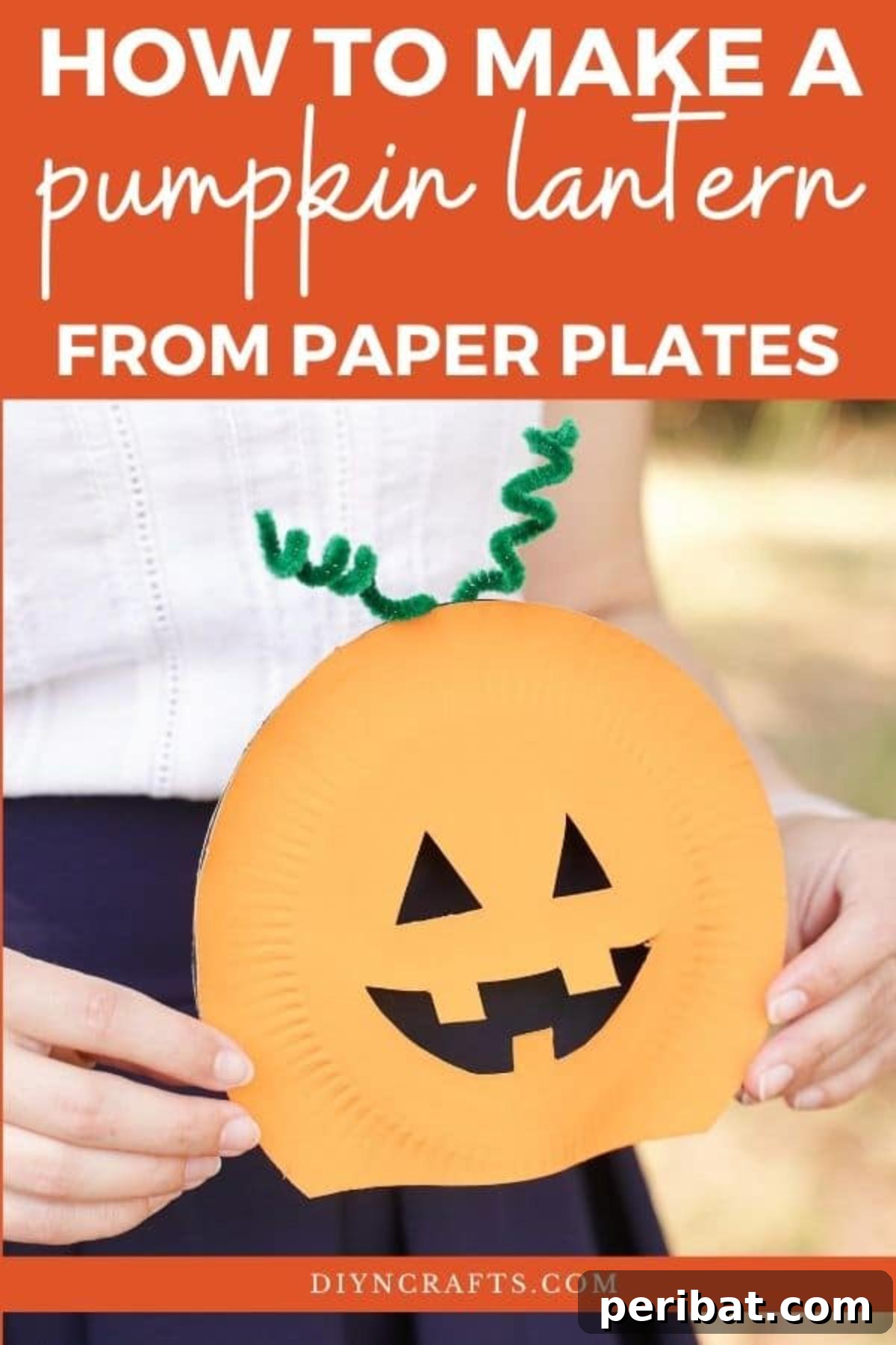Grinning Gourd Lanterns: A Paper Plate Craft for Kids 2 Woman holding a smiling paper plate pumpkin lantern