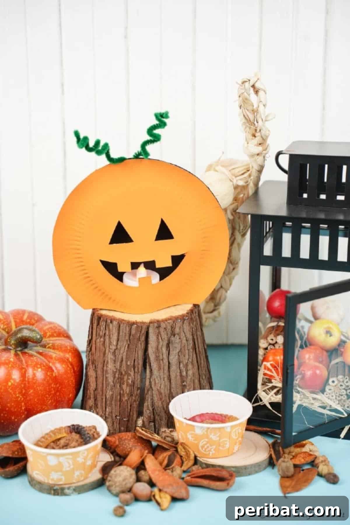 Grinning Gourd Lanterns: A Paper Plate Craft for Kids 25 Paper plate pumpkin lantern displayed with various Halloween decorations